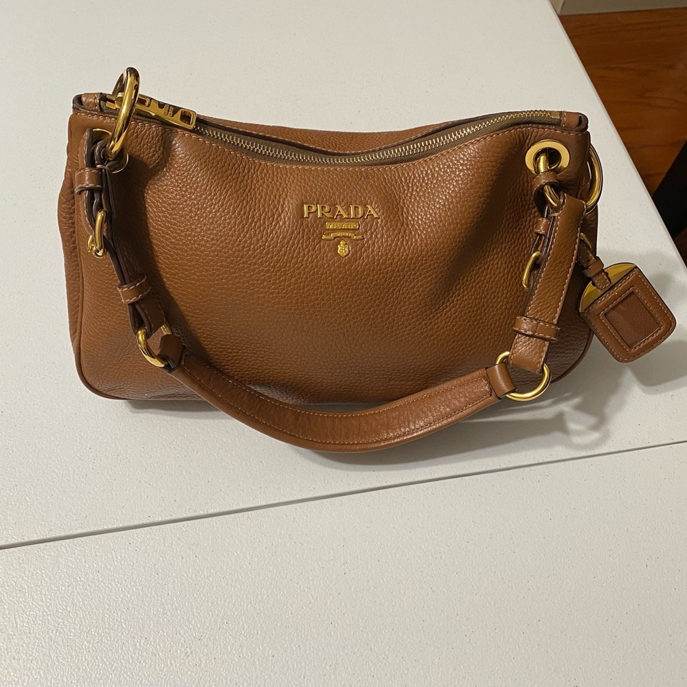 Prada classic brown leather shoulder bag.